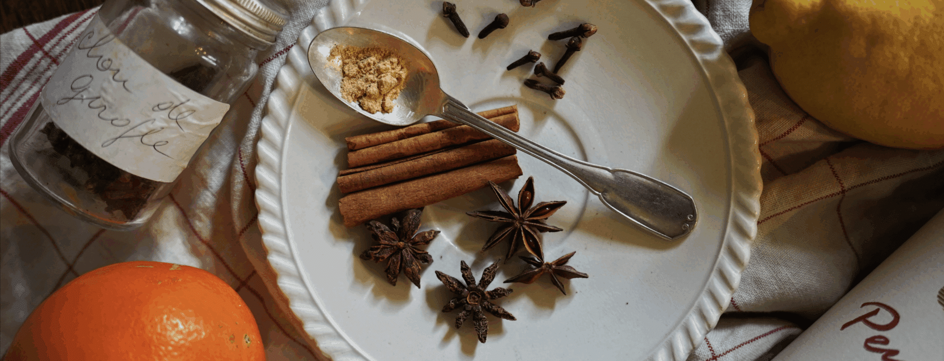 cinnamon stick and star anise on a plate