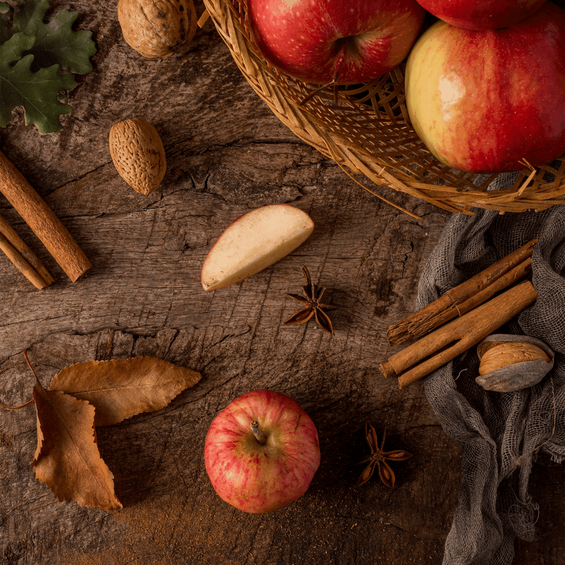 a basket full of apples and a slice of apple